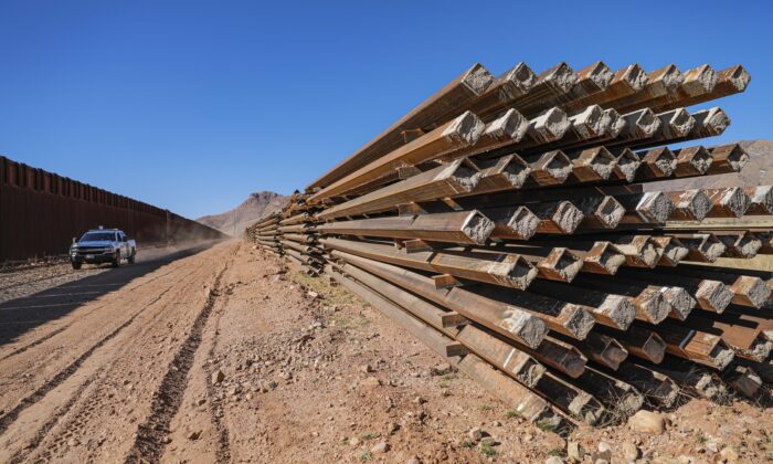 Border wall panels sit untouched since January 2021 when President Joe Biden halted all border wall construction, in Cochise County, Ariz., on Dec. 6, 2021. (Charlotte Cuthbertson/The Epoch Times)