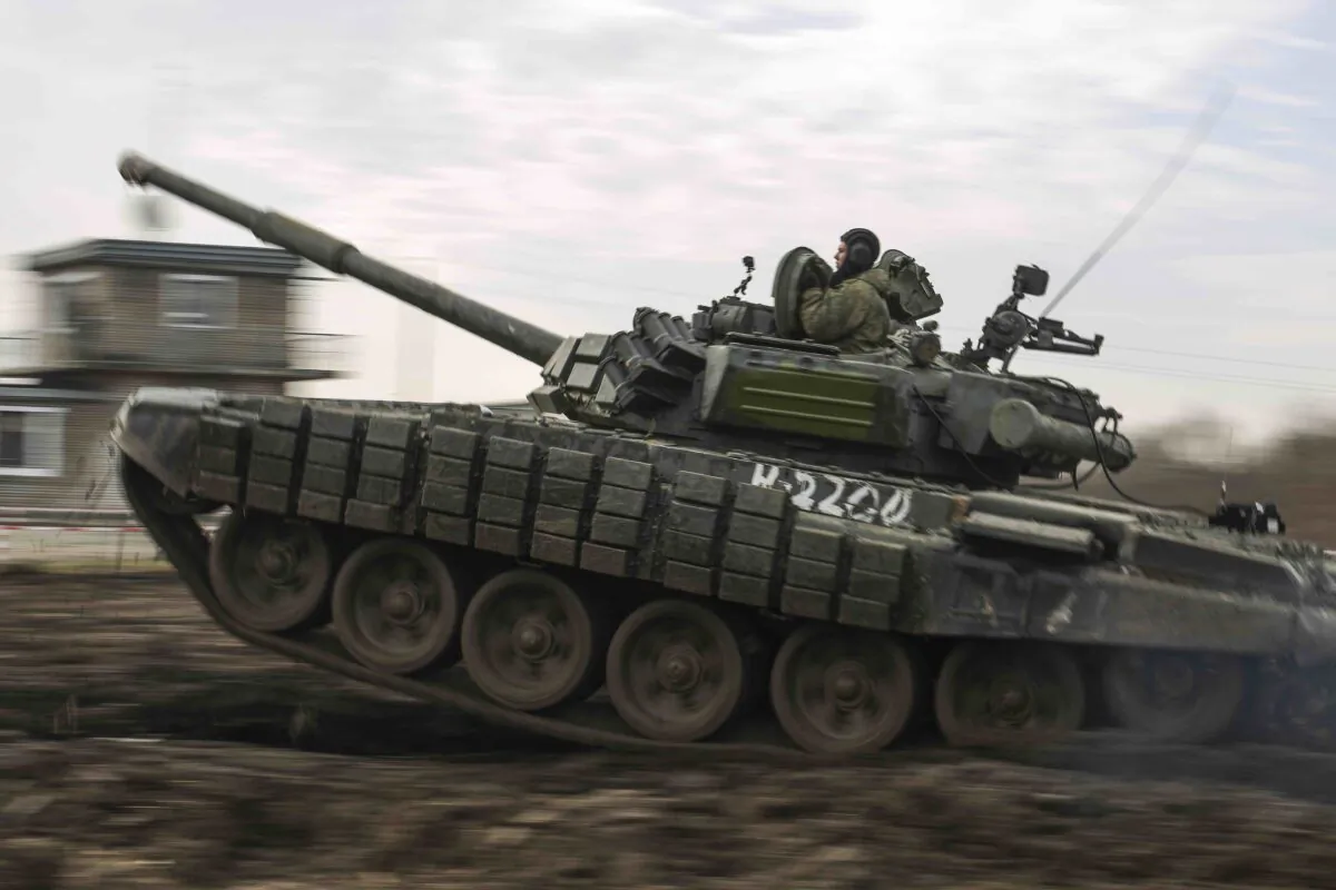 A Russian tank rolls during military drills at Molkino training ground in the Krasnodar region, Russia, on Dec. 14, 2021. (AP)
