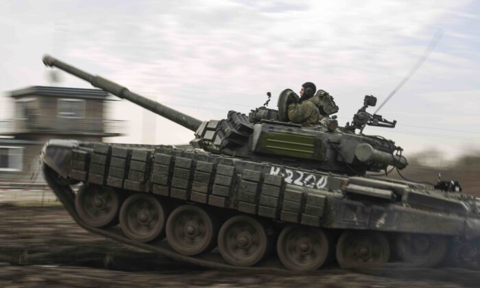 A Russian tank rolls during military drills at Molkino training ground in the Krasnodar region, Russia, on Dec. 14, 2021. (AP)