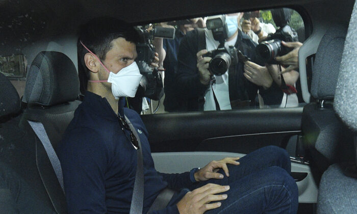 Serbian tennis player Novak Djokovic rides in car as he leaves a government detention facility before attending a court hearing at his lawyers office in Melbourne, Australia, on Jan. 16, 2022. (James Ross/AAP via AP)