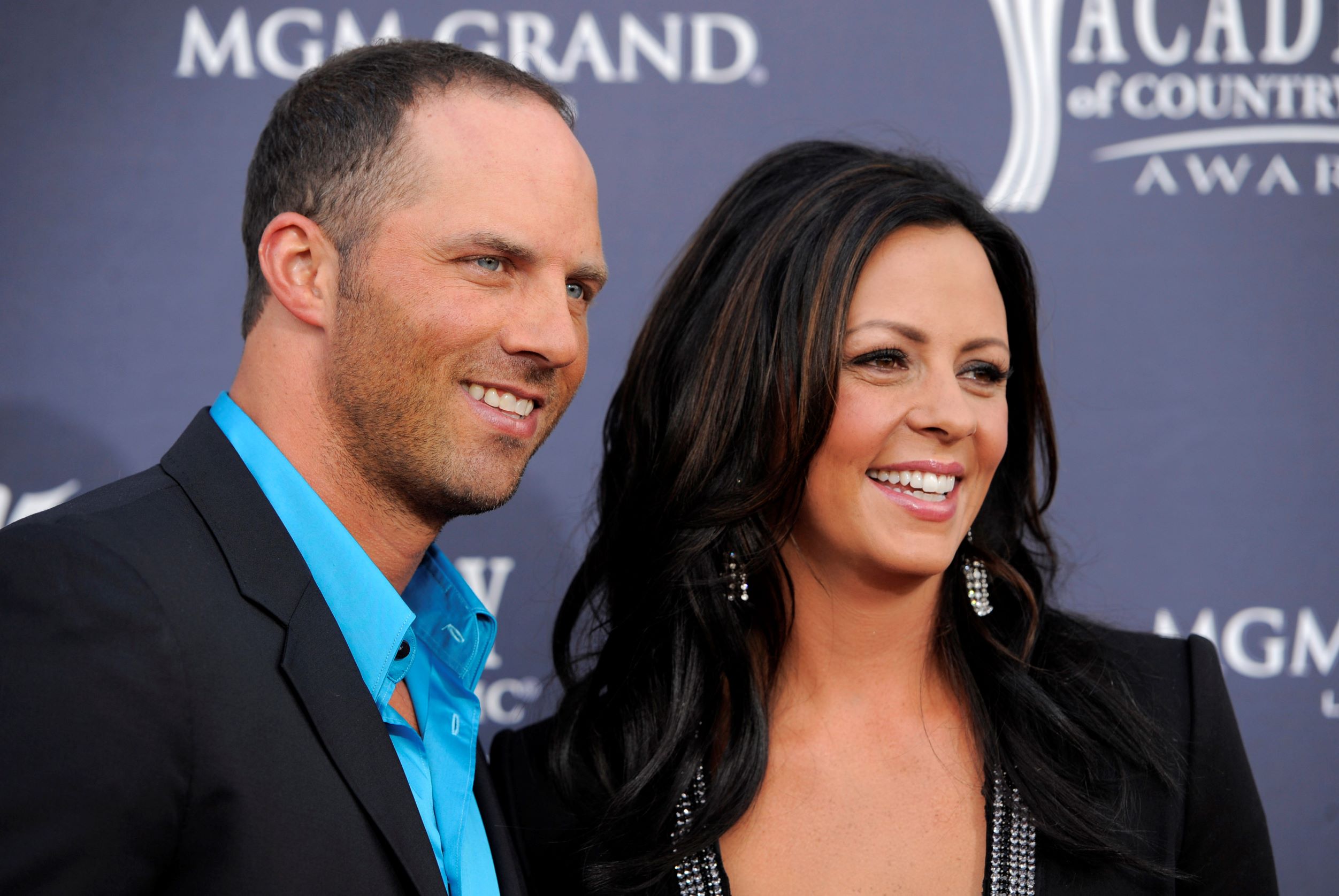Jay Barker (L), and his wife country music singer Sara Evans