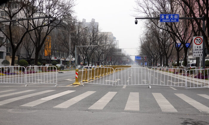 A road in Xi'an, China's northern Shaanxi Province, was blocked amid a COVID lockdown on Dec. 31, 2021. (STR/AFP via Getty Images)