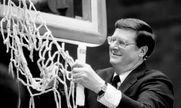 Kentucky head coach Joe B. Hall enjoys the traditional cutting of the net after his team scored a 51–49 win over Auburn for the SEC tournament championship title at Memorial Gym in Nashville, Tenn., on March 10, 1984. (Ricky Rogers/The Tennessean, Nashville Tennessean/Imagn Content Services via Field Level Media)