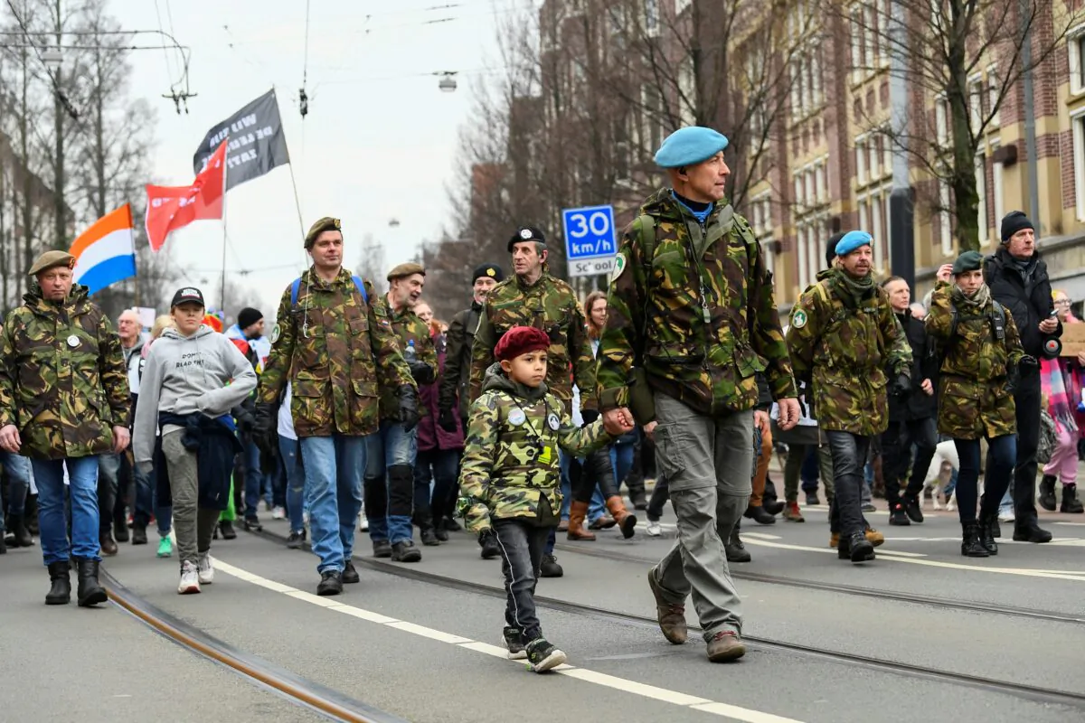 Demonstrators take part in a protest against the Dutch government's COVID-19 restrictions, in Amsterdam, Netherlands, on Jan. 16, 2022. (Piroschka van de Wouw/Reuters)