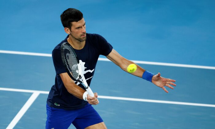 Novak Djokovic of Serbia plays a forehand during a practice session ahead of the 2022 Australian Open at Melbourne Park in Melbourne, Australia, on Jan. 14, 2022. (Daniel Pockett/Getty Images)
