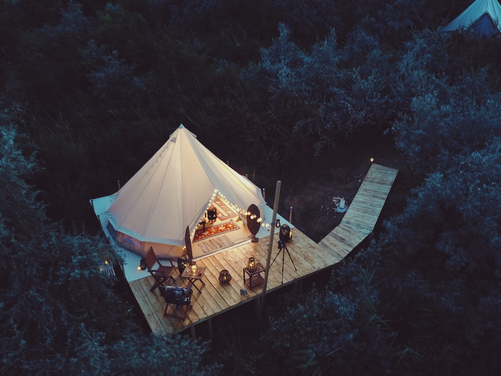 Who said all 5-star resorts are hotels? Glamping is enjoying decadent luxury in unspoiled settings. (Moise Sebastian/Shutterstock)
