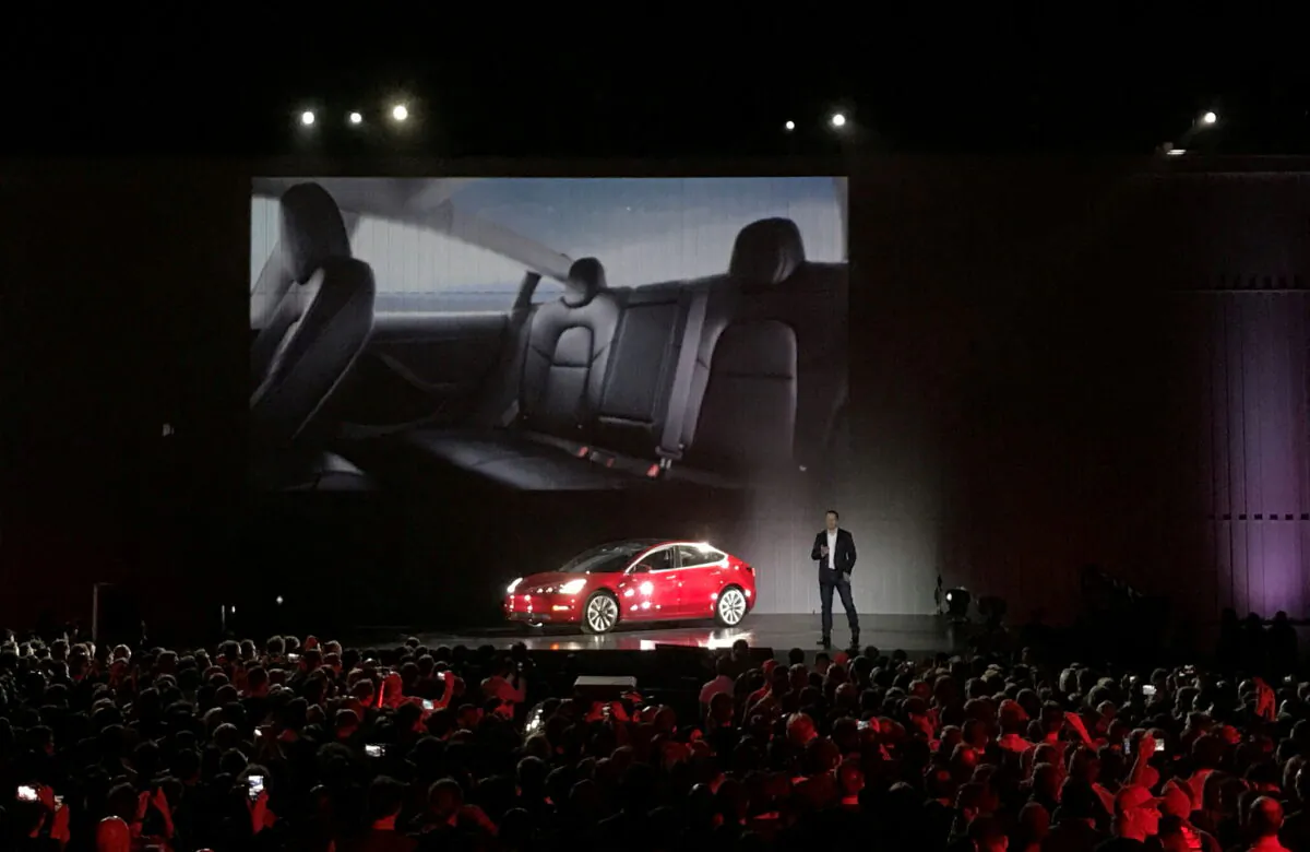 Tesla Chief Executive Elon Musk introduces one of the first Model 3 cars off the Fremont factory's production line during an event at the company's facilities in Fremont, California, U.S., July 28, 2017. (Reuters/Alexandria Sage)