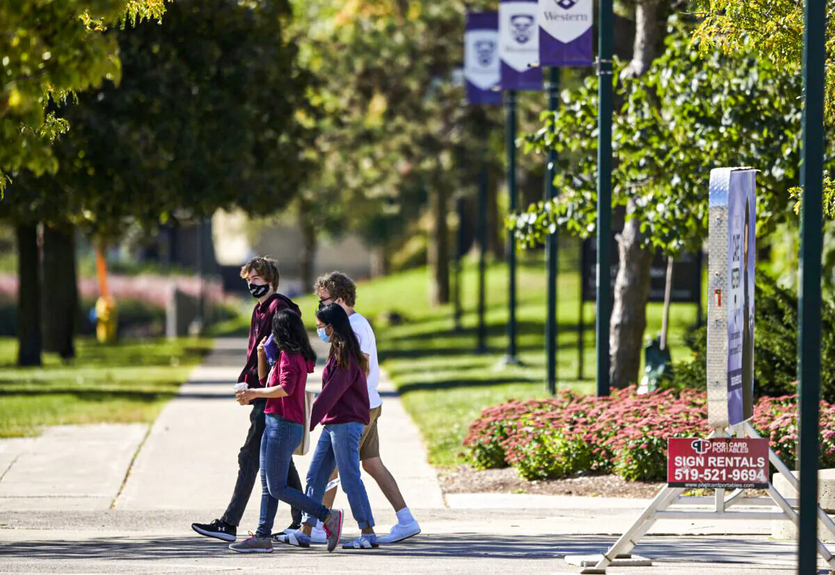 Students walk through the campus at Western University in London, Ont., on Sept. 19, 2020. (The Canadian Press/Geoff Robins)