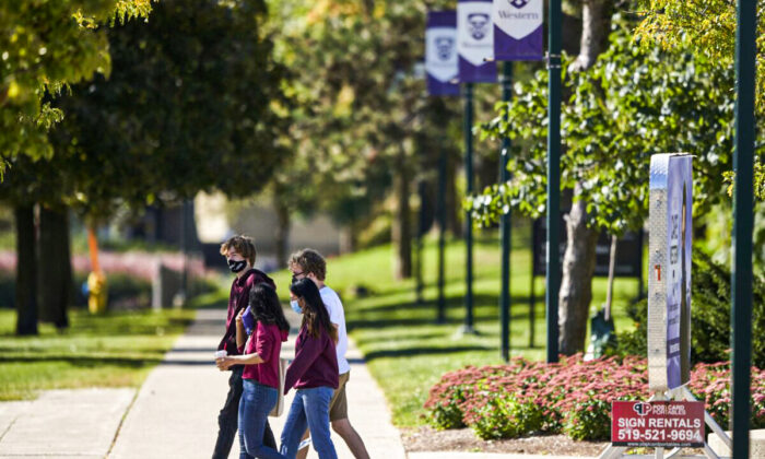 Students walk through the campus at Western University in London, Ont., on Sept. 19, 2020. (The Canadian Press/Geoff Robins)