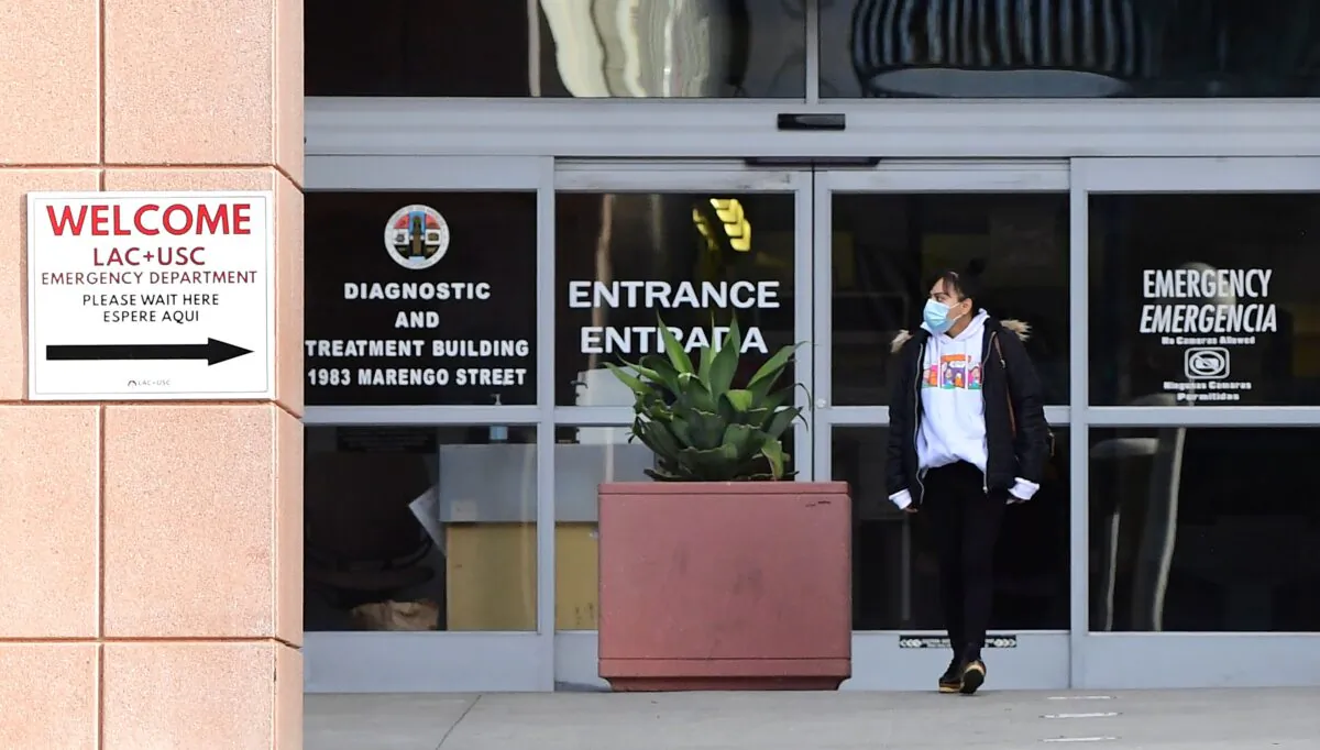 A woman steps out of the Emergency section at the now Los Angeles General Medical Center in Los Angeles on Dec. 8, 2020. (Frederic J. Brown/AFP via Getty Images)