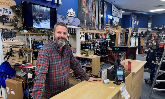 Phillip Howard poses for a photo inside his Troy's Ski Lubbock shop, in Lubbock, Texas, on Jan. 14, 2022. (Brad Brooks/Reuters)