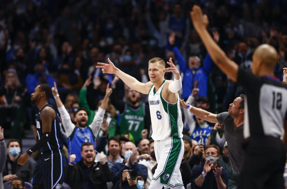 Dallas Mavericks forward Kristaps Porzingis (6) celebrates a three-point basket at the buzzer at the end of the first quarter of an NBA basketball game against the Orlando Magic in Dallas, on Jan. 15, 2022. (Brandon Wade/AP Photo)