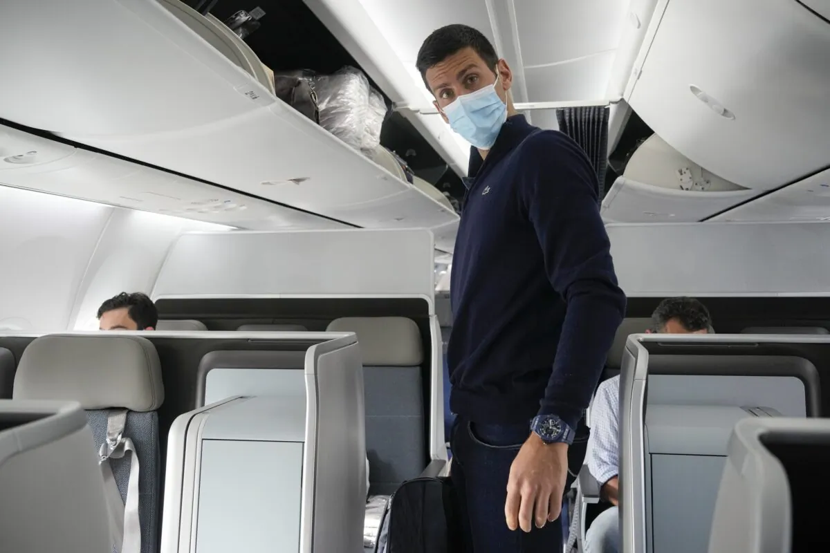 Novak Djokovic prepares to take his seat on a plane to Belgrade, in Dubai, United Arab Emirates, on Jan. 17, 2022. (Darko Bandic/AP Photo)