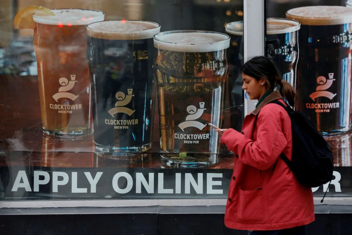 A sign advertising available jobs at the Clocktower Brew Pub hangs in a window in Ottawa, Ontario, Canada, on Nov. 9, 2017. (Chris Wattie/Reuters)