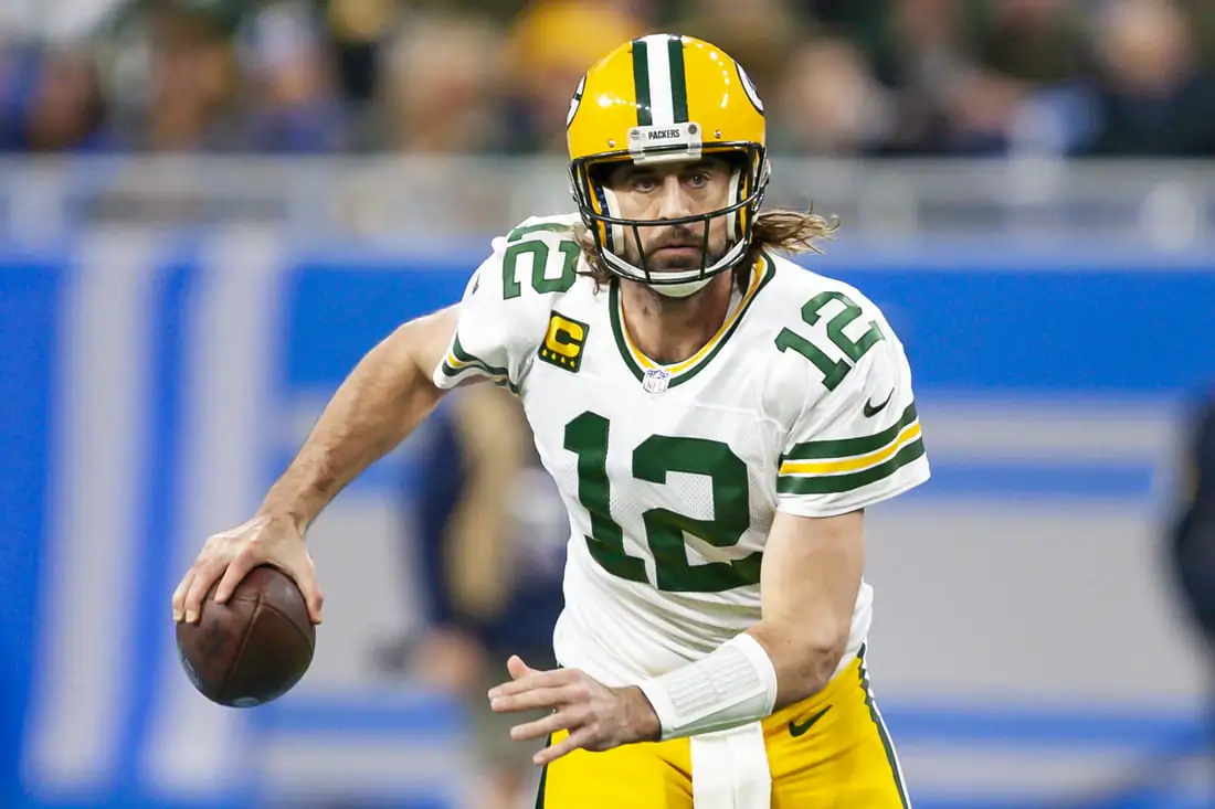 Green Bay Packers quarterback Aaron Rodgers (12) runs the ball during the first quarter against the Detroit Lions at Ford Field in Detroit, Mich., on Jan 9, 2022. (Raj Mehta-USA TODAY Sports)
