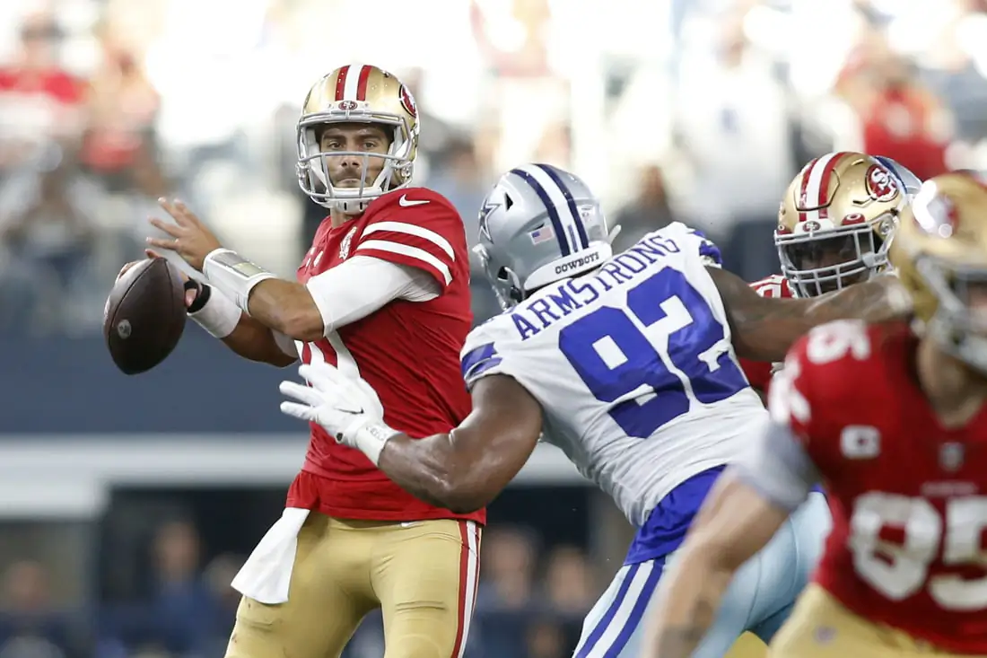 San Francisco 49ers quarterback Jimmy Garoppolo (10) throws the ball against Dallas Cowboys defensive end Dorance Armstrong (92) in the second quarter in a NFC Wild Card playoff football game at AT&T Stadium in Arlington, Texas, USA, on Jan 16, 2022. (Tim Heitman-USA TODAY Sports Via Field Level Media)