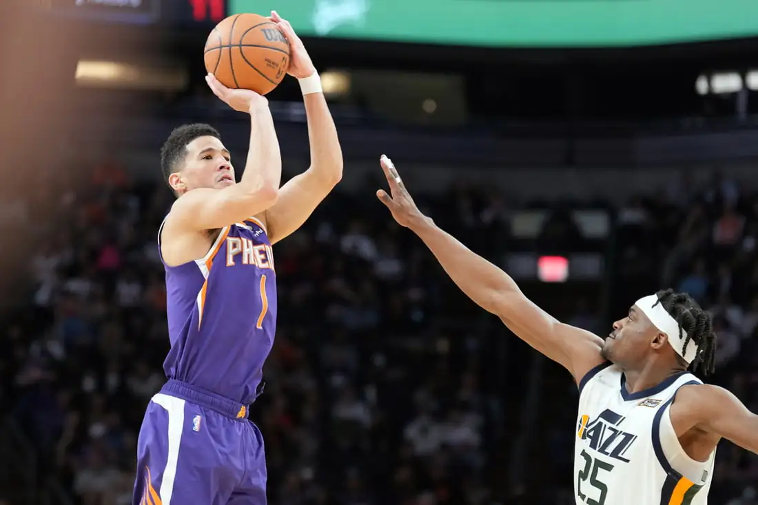 Phoenix Suns guard Devin Booker (1) shoots over Utah Jazz forward Danuel House Jr (25) during the second half at Footprint Center in Phoenix, Ariz., on Jan. 24, 2022. (Joe Camporeale/USA TODAY Sports via Field Level Media)
