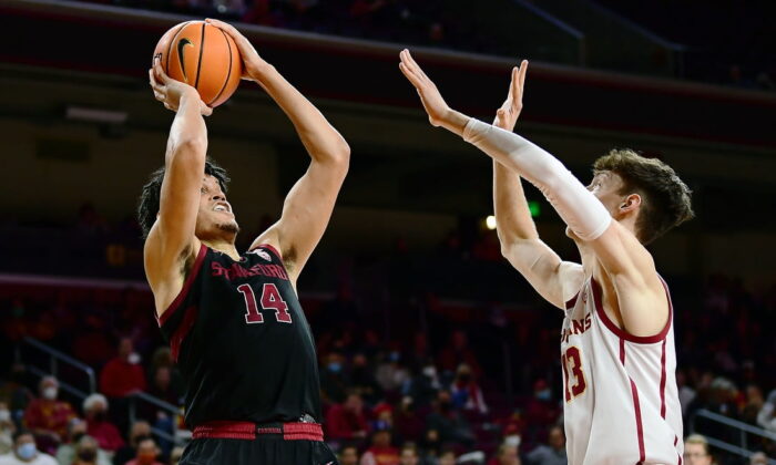 Stanford Cardinal forward Spencer Jones (14) shoots against Southern California Trojans guard Drew Peterson (13) during the second half at Galen Center, in Los Angeles on Jan 27, 2022. (Gary A. Vasquez/USA TODAY Sports via Field Level Media)