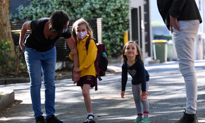 School students return back to school after COVID-19 restrictions were lifted, at Glebe Public School in Sydney, Australia, on Oct. 18, 2021. (AAP Image/Bianca De Marchi)