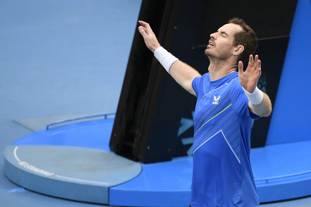 Andy Murray of Britain reacts, after defeating Nikoloz Basilashvili of Georgia in their first round match at the Australian Open tennis championships in Melbourne, on Jan. 18, 2022. (Andy Brownbill/AP Photo)