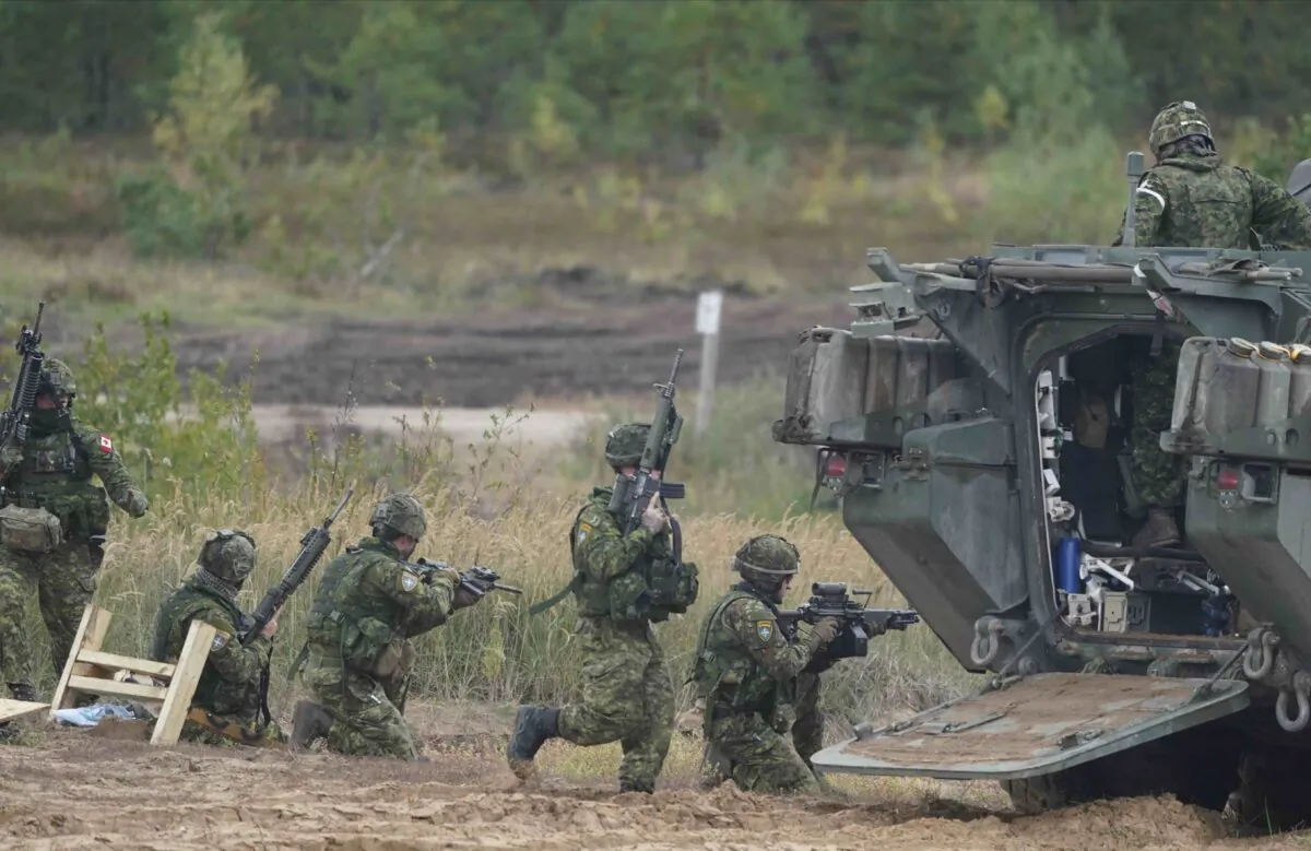 Canadian soldiers attend the NATO military exercises ''Namejs 2021'' at a training ground in Kadaga, Latvia, on Monday, Sept. 13, 2021. (AP/Roman Koksarov)