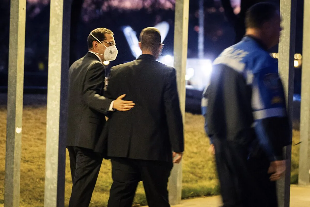 Congregation Beth Israel Rabbi Charlie Cytron-Walker, left, walks into a healing service with an unidentified man, at White’s Chapel United Methodist Church in Southlake, Texas, on Jan. 17, 2022. (Yffy Yossifor/Star-Telegram via AP)