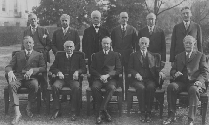 U.S. President Calvin Coolidge and his Cabinet: (seated, from left) Secretary of War Dwight F. Davis, Secretary of State Frank B. Kellogg, President Calvin Coolidge, Secretary of the Treasury Andrew W. Mellon, and Attorney General John G. Sargent, (standing, from left) Postmaster General Harry S. New, Secretary of Labor James J. Davis, Secretary of Commerce William F. Whiting, Secretary of Agriculture William M. Jardine, Secretary of the Interior Roy O. West, and Secretary of the Navy Curtis D. Wilbur, on Jan. 4, 1929. (FPG/Getty Images)