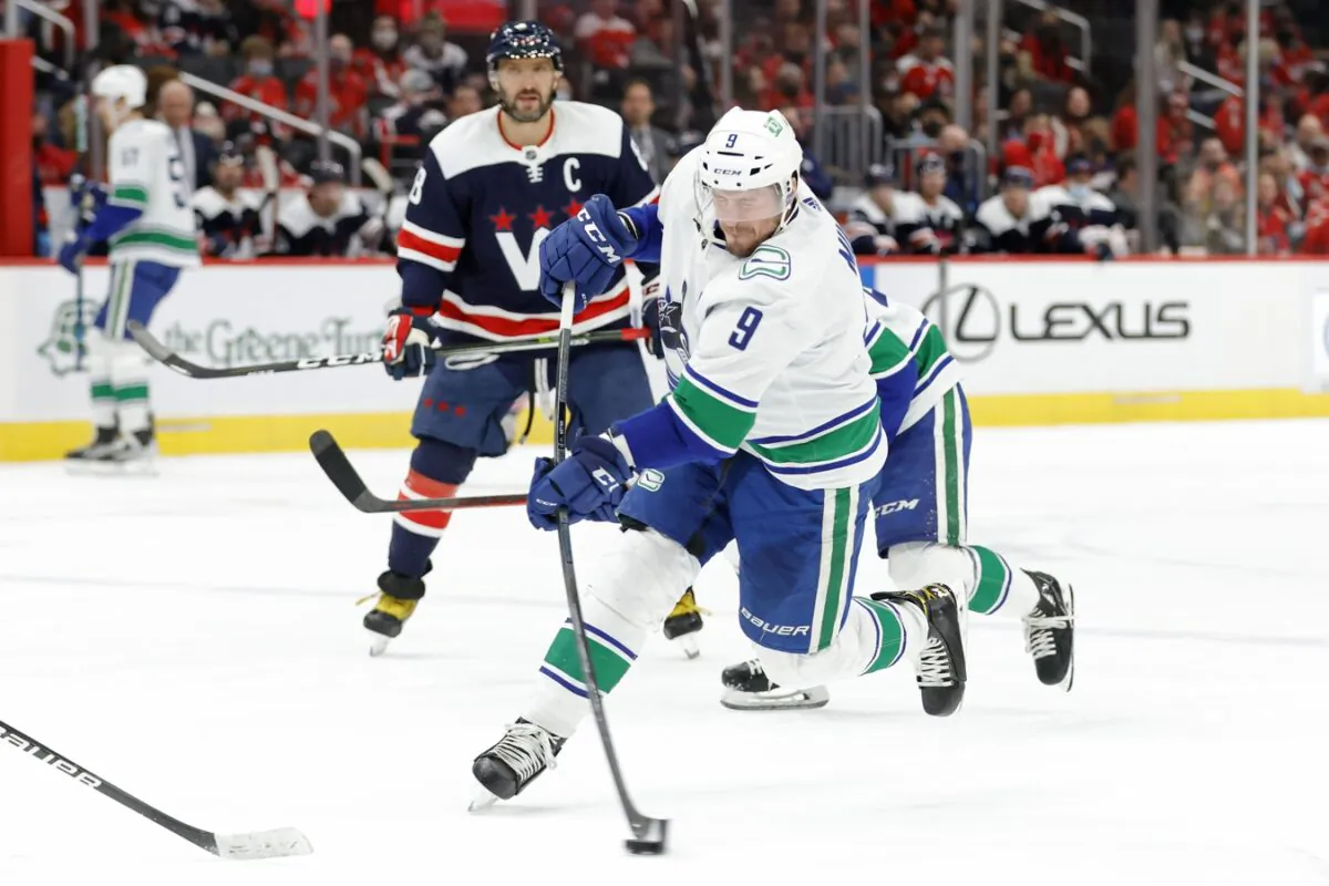 Vancouver Canucks center J.T. Miller (9) shoots the puck against the Washington Capitals during the second period at Capital One Arena, in Wash., on Jan. 16, 2022. (Geoff Burke/USA TODAY Sports via Field Level Media)