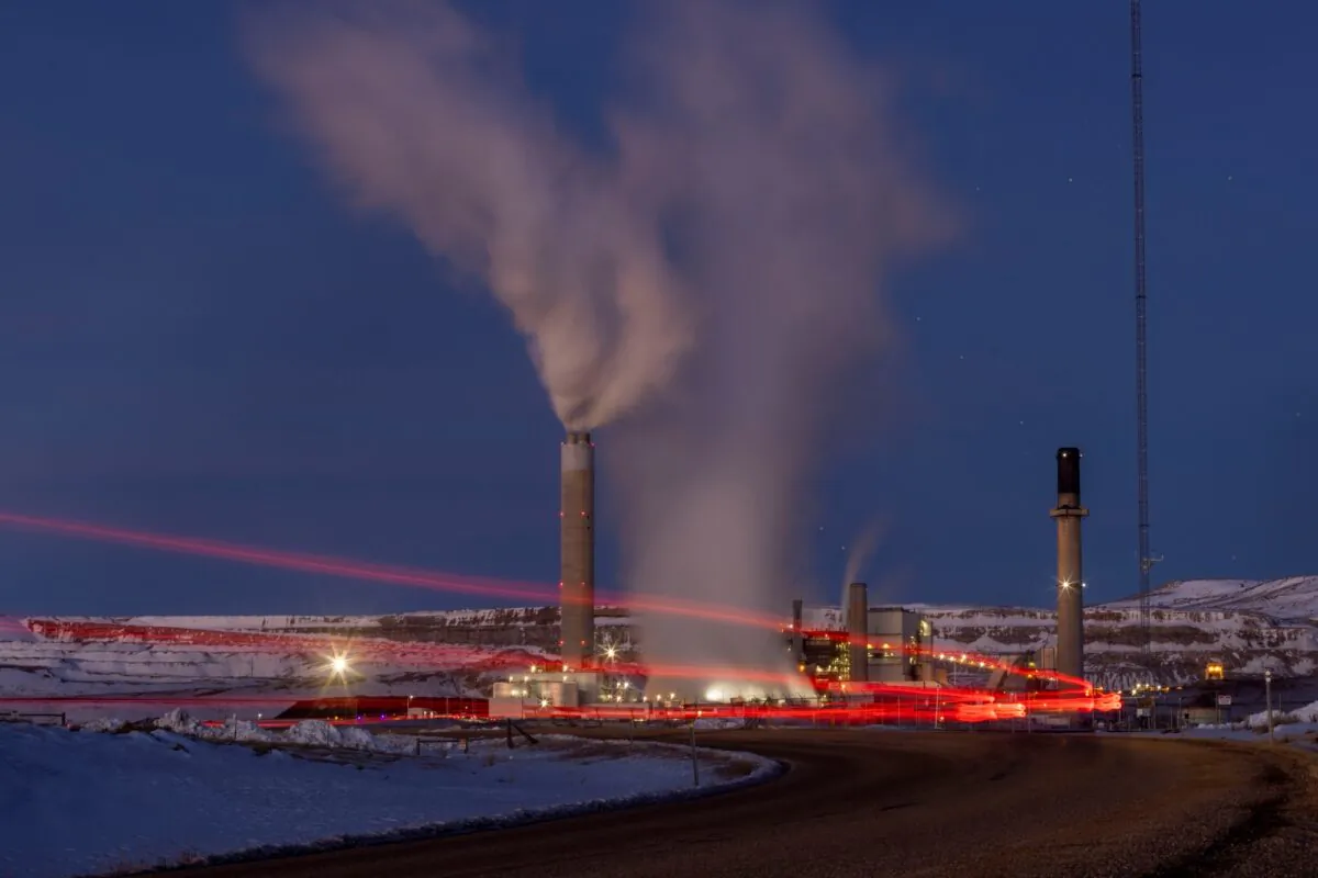 In this photo taken with a slow shutter speed, taillights trace the path of a motor vehicle at the Naughton Power Plant 2022 in Kemmerer, Wyo., on Jan. 2013. (Natalie Behring/AP Photo)