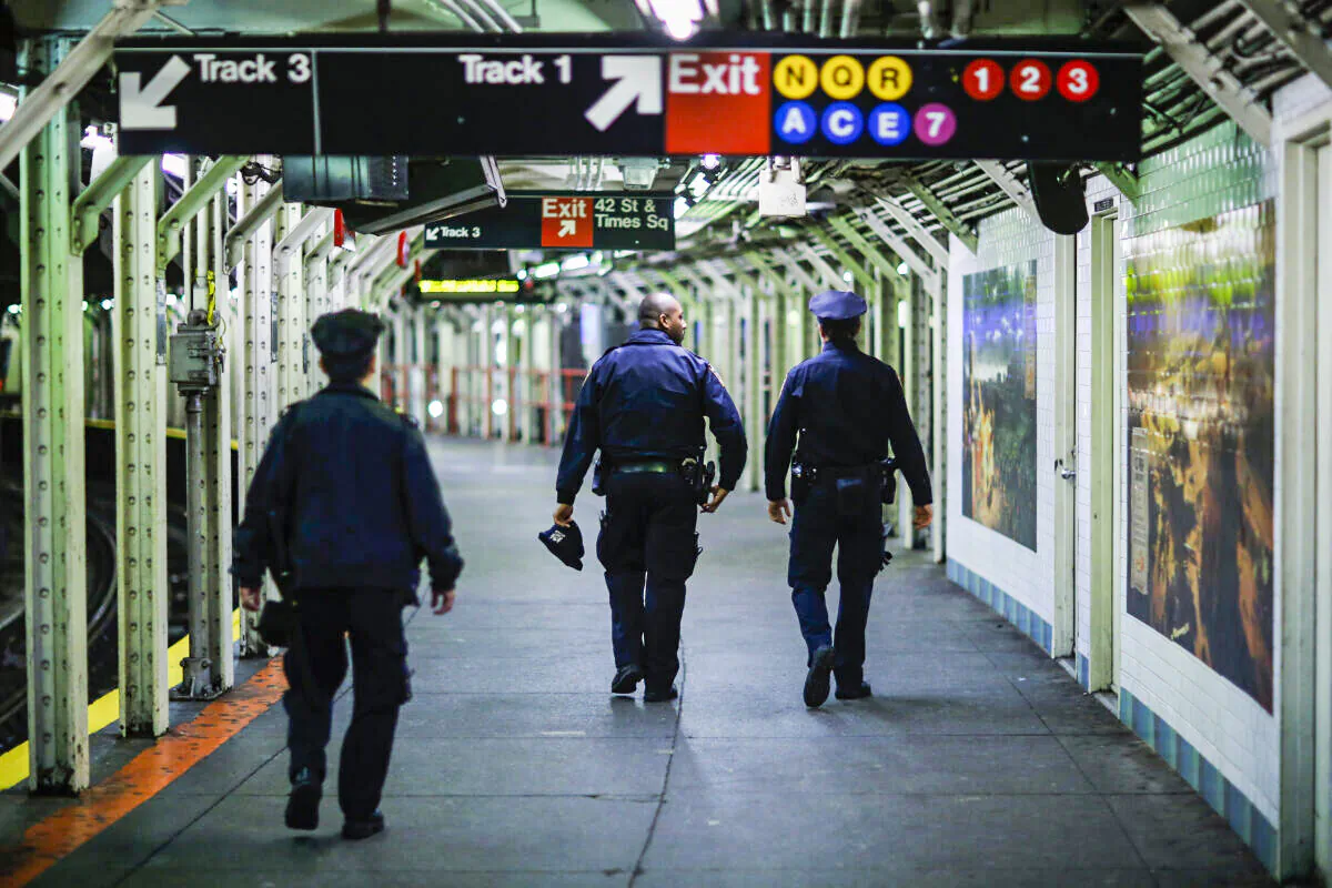 A file photo shows New York Police Officers patrol on the subway station of Times Square in New York City, on Dec. 31, 2015.