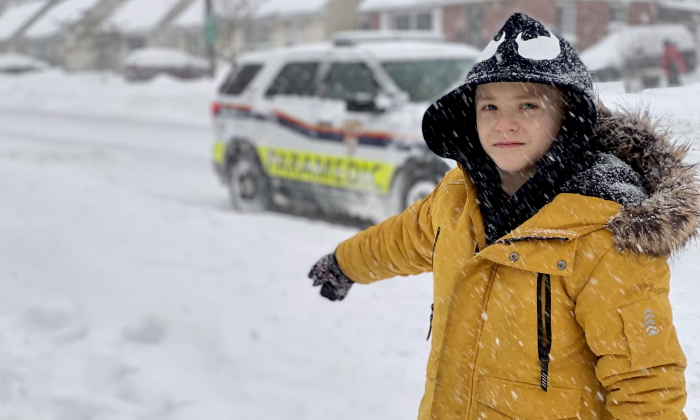 Clayton McGuire points to the spot where he found and assisted an elderly man who had fallen in the heavy snow on Jan. 17, 2022. (Ottawa Paramedic Service)
