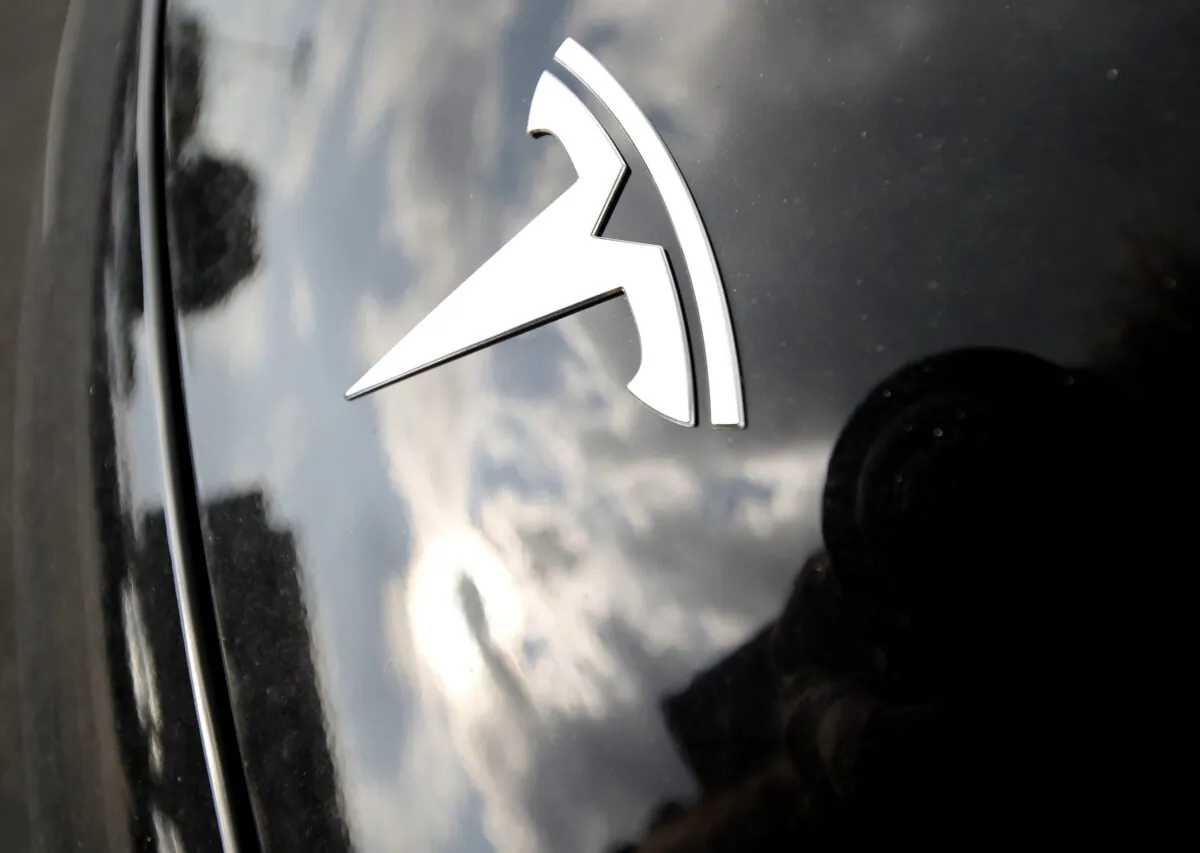 The company logo on the hood of a Tesla vehicle outside a showroom in Littleton, Colo., on July 8, 2018. (David Zalubowski/AP Photo)