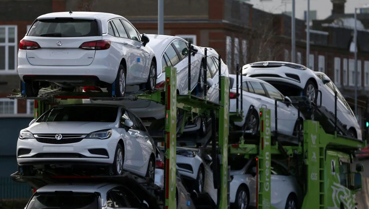 Vauxhall cars are transported on a lorry in Luton, Britain, on March 6, 2017. (Neil Hall/Reuters)