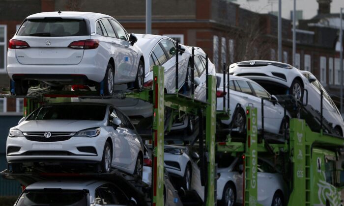 Vauxhall cars are transported on a lorry in Luton, Britain, on March 6, 2017. (Neil Hall/Reuters)