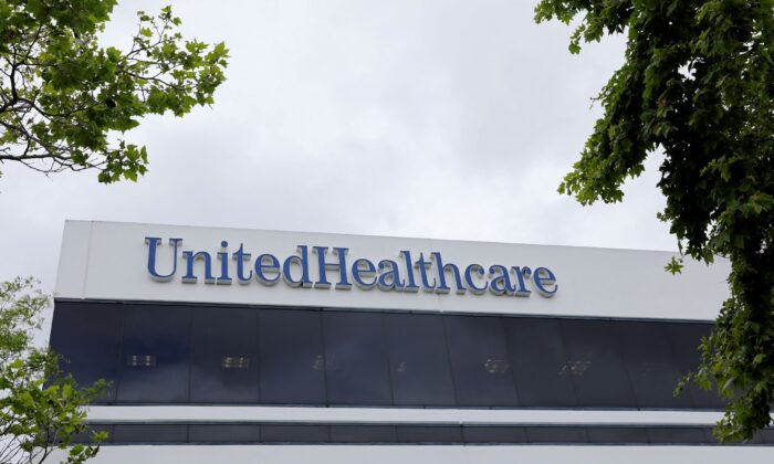 The corporate logo of the UnitedHealth Group appears on the side of one of their office buildings in Santa Ana, Calif., on April 13, 2020. (Mike Blake/Reuters)