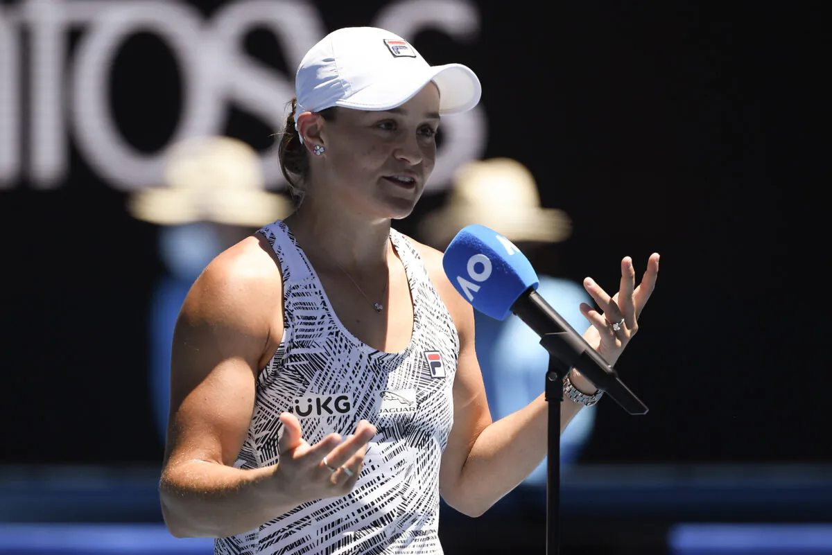 Ash Barty of Australia reacts as she is interviewed after defeating Lucia Bronzetti of Italy in their second round match at the Australian Open tennis championships in Melbourne, Australia, on Jan. 19, 2022. (Andy Brownbill/AP Photo)