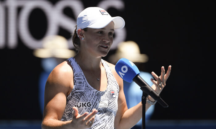 Ash Barty of Australia reacts as she is interviewed after defeating Lucia Bronzetti of Italy in their second round match at the Australian Open tennis championships in Melbourne, Australia, on Jan. 19, 2022. (Andy Brownbill/AP Photo)