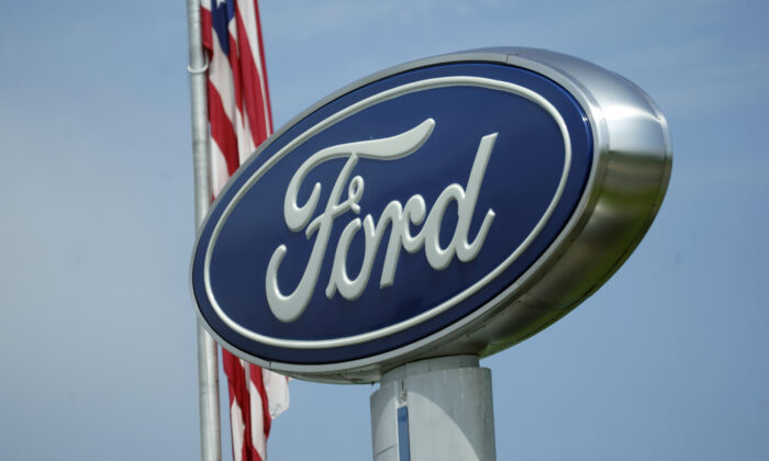 A Ford logo on signage at Country Ford in Graham, N.C., on July 27, 2021.  (Gerry Broome/AP Photo)