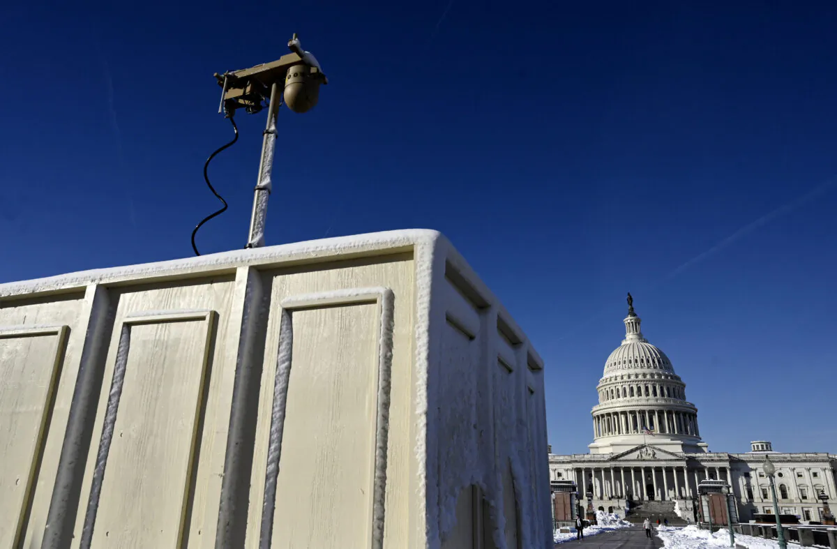 Newly installed surveillance cameras are positioned near the US Capitol Building on Jan. 4, 2022, in Washington. (Photo by OLIVIER DOULIERY / AFP) (Photo by OLIVIER DOULIERY/AFP via Getty Images)
