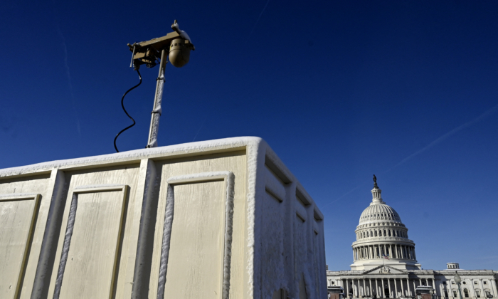 Newly installed surveillance cameras are positioned near the US Capitol Building on Jan. 4, 2022, in Washington. (Photo by OLIVIER DOULIERY / AFP) (Photo by OLIVIER DOULIERY/AFP via Getty Images)