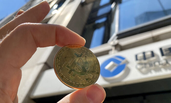 In this photo illustration, a visual representation of bitcoin cryptocurrency is pictured in London on May 30, 2021. (Edward Smith/Getty Images)