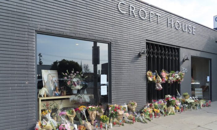 Flowers are placed outside Croft House furniture store in memory of graduate student Brianna Kupfer in Los Angeles on Jan. 18, 2022. (Alice Sun/The Epoch Times)