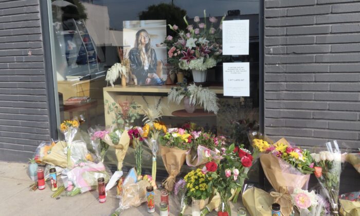 Flowers placed outside Croft House furniture store in memory of graduate student Brianna Kupfer, in Los Angeles on Jan. 18, 2022. (Alice Sun/The Epoch Times)