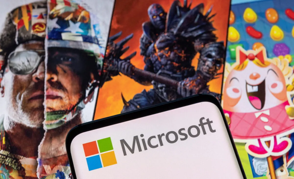 The Microsoft logo is seen in front of characters from Activision Blizzard games. (Dado Ruvic/Reuters)
