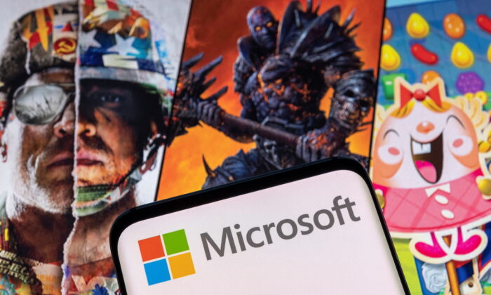 The Microsoft logo is seen in front of characters from Activision Blizzard games. (Dado Ruvic/Reuters)