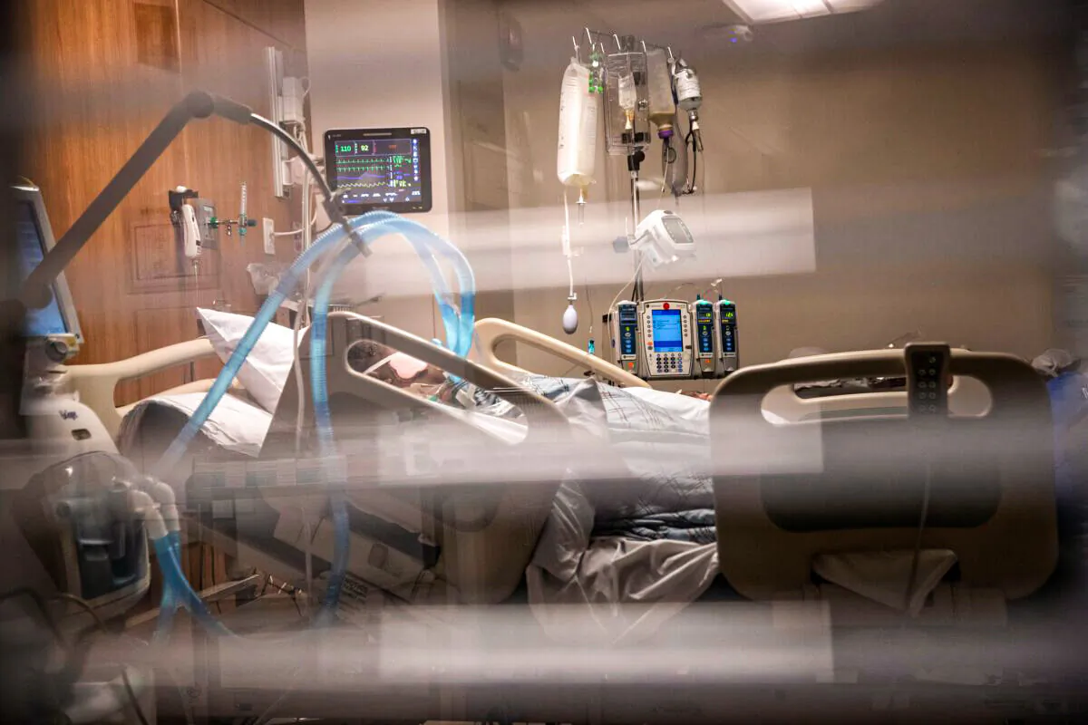 Breathing tubes hang next to a man with COVID-19 on a ventilator at a Stamford Hospital Intensive Care Unit in Stamford, Conn. on April 24, 2020. (John Moore/Getty Images)