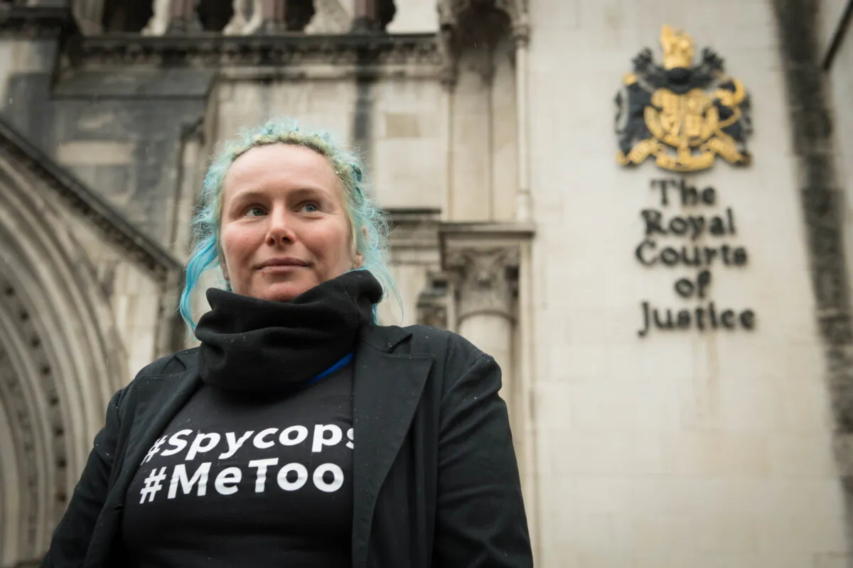 Environmental activist Kate Wilson, who was deceived into a nearly two-year relationship with an undercover officer, and has won a landmark tribunal case against the Metropolitan Police for breaches of her human rights, poses for photos outside the Royal Courts of Justice in London on Feb. 27, 2020. (Stefan Rousseau/PA)