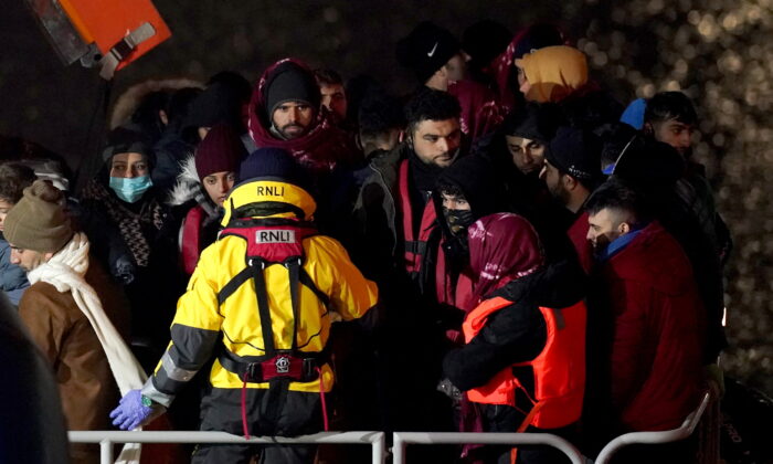 A group of people thought to be illegal immigrants onboard the Dover lifeboat are brought in to Dover, Kent, on Jan. 15, 2022. (Gareth Fuller/PA)