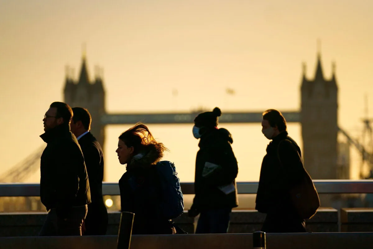 This undated file image shows pedestrians  walking in front of Tower Bridge in London. (Victoria Jones/PA)