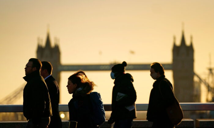 This undated file image shows pedestrians  walking in front of Tower Bridge in London. (Victoria Jones/PA)